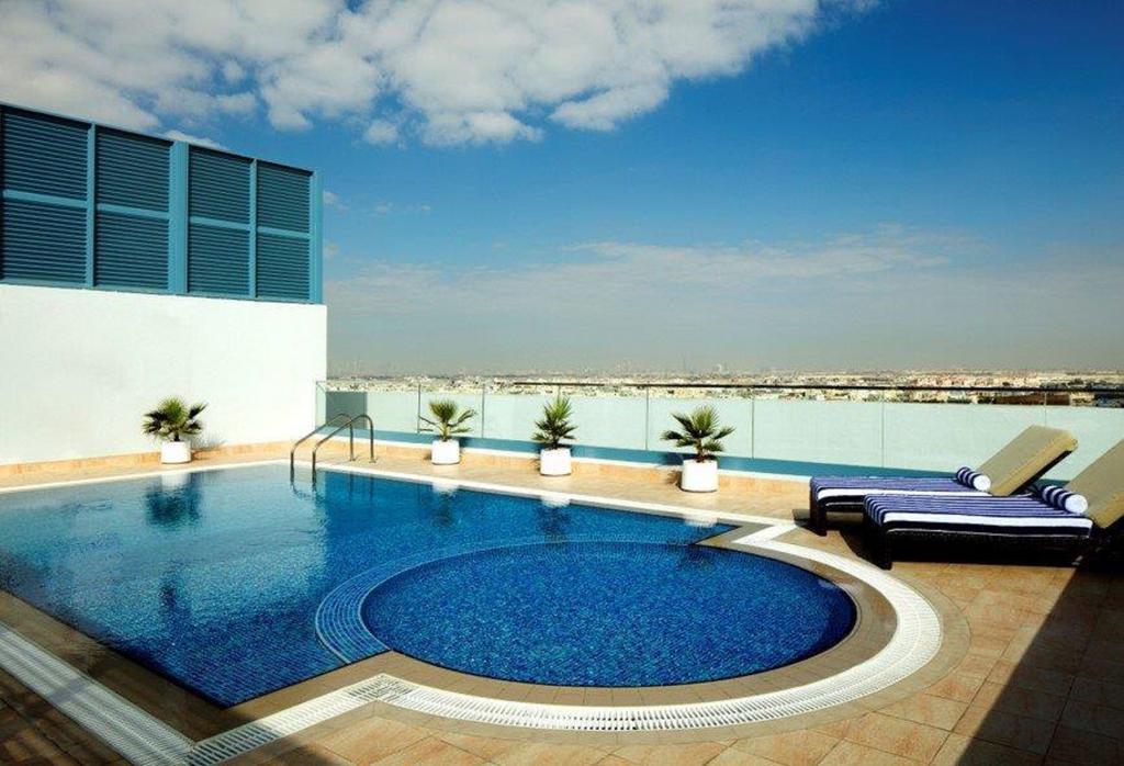 Radisson Blu Hotel Apartments Dubai Silicon Oasis 4*
