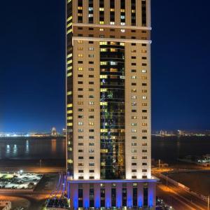 отель Magnum Hotel & Suites West Bay