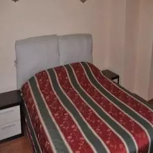 отель Flora Apartments
