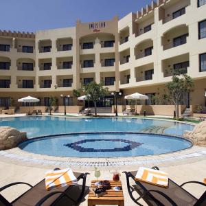 отель Swiss Inn Pyramids Golf Resort