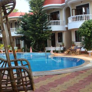 отель Naga Cottages