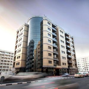 отель Xclusive Maples Hotel Apartments